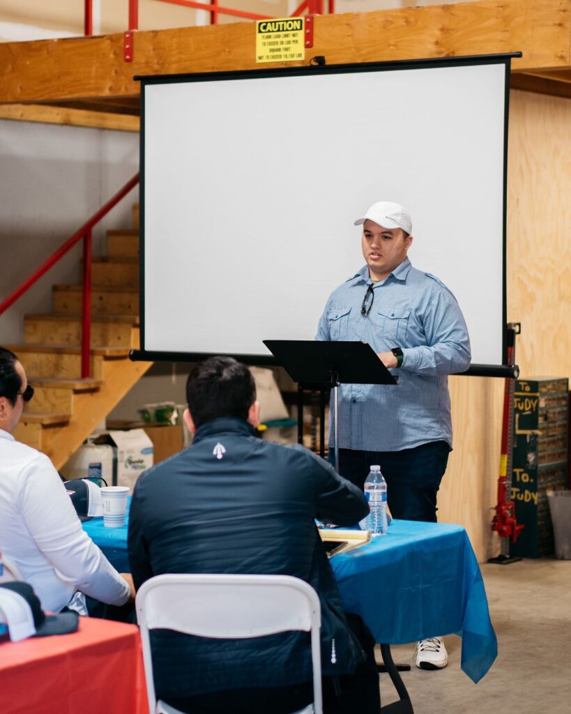 AMárquez Agency founder speaking to a room of trades business owners in Fresno, California.